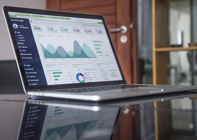 Laptop showing analytics and code