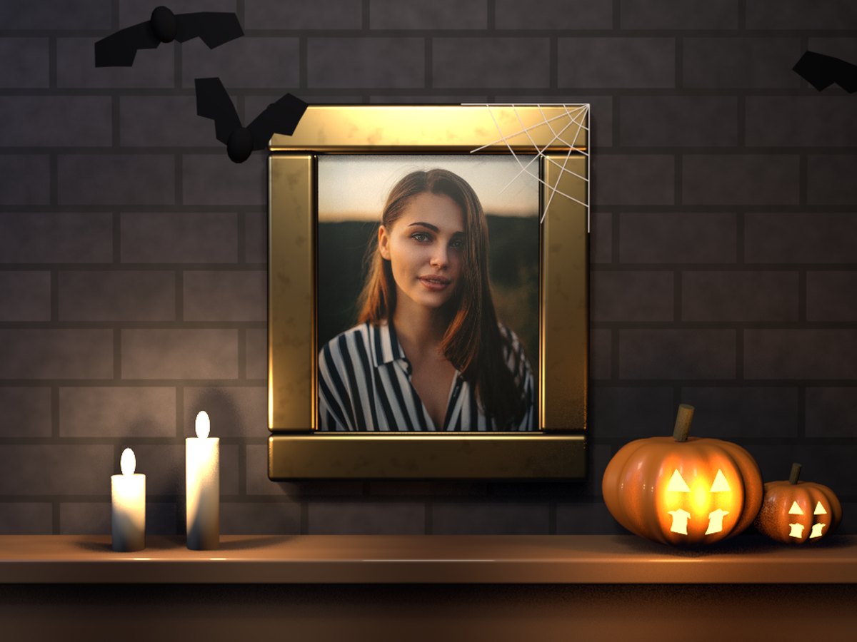 Halloween GIF: a portrait of a woman in a gilded frame on a stone wall, with candles, two carved pumpkins and bats